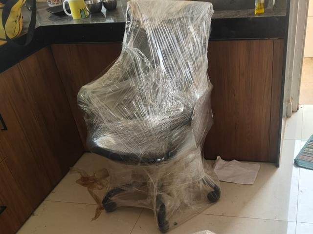 Furniture wrapped in stretch film for a home move