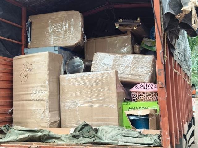 Truck loaded with wrapped cartons and household goods